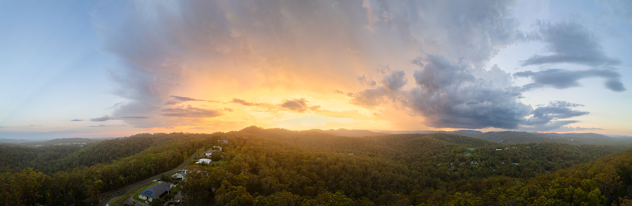 The magnificent, sunset light of a small storm over the Gold Coast Hinterland, Australia